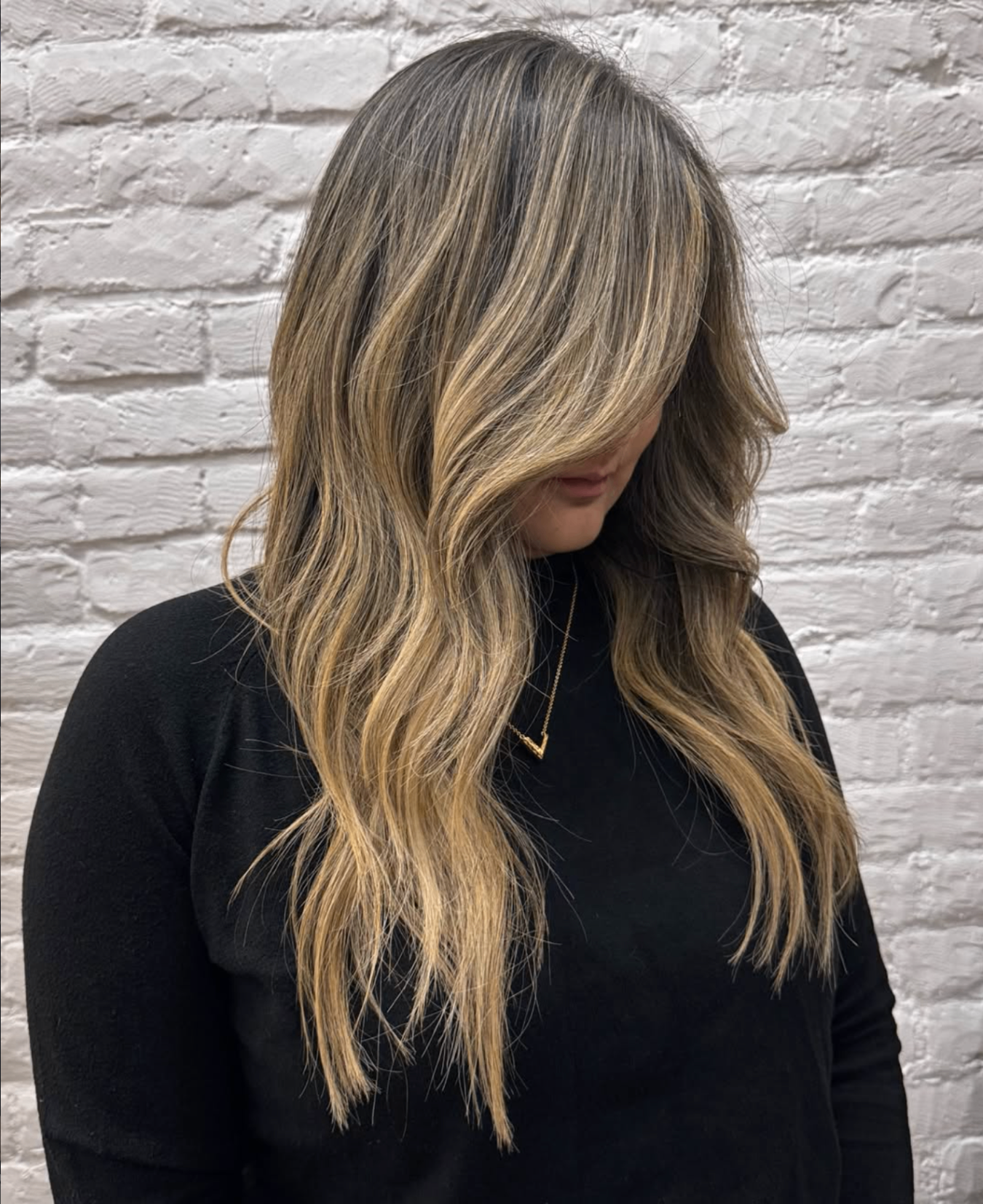 Long blonde balayage with ribbon highlights